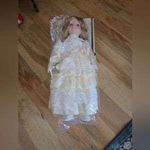 Elegant Cream Porcelain Doll